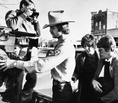 In this Feb. 16, 1984, file photo, Genene Jones, second right, is escorted into Williamson County Courthouse in Georgetown, Texas. Jones, a former nurse who’s been serving a 99-year prison sentence since 1984 for the fatal overdose of an infant in her care, is due for early release in March 2018. A grand jury indicted her on Thursday, May 25, 2017, in the death of another infant as prosecutors try to keep her behind bars. (Ted Powers / Associated Press)