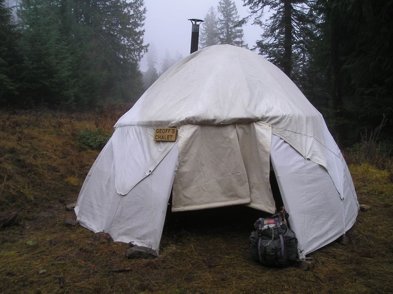 The snowshoer's warming hut maintained by the Panhandle Nordic Club sits in the snowless mountains at Fourth of July Pass on Dec. 18, 2014.  (Geoff Harvey)