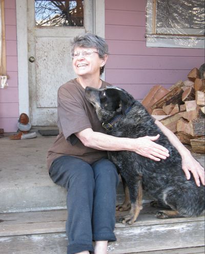 Judy Camp sits with her blue heeler.