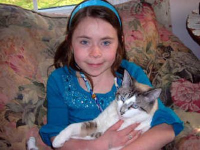 
Matilda Greiner, holding her cat Izzy, hopes one day to be a veterinarian. She is a supporter of area animal shelters. 
 (JENNIFER LARUE / The Spokesman-Review)