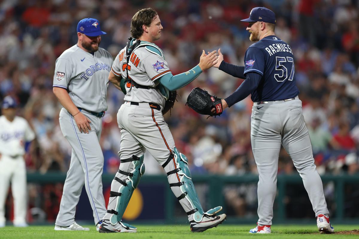 Tampa Bay pitcher Drew Rasmussen, right, a Mt. Spokane grad, shakes hands with Baltimore’s Adley Rutschman during the seventh inning of the MLB All-Star Game in Philadelphia. Rasmussen recorded two outs, striking out one, before being replaced after walking a batter. (Getty Images)