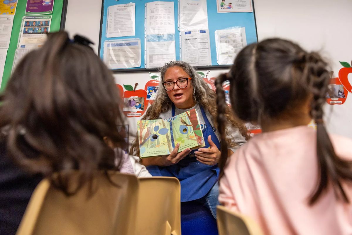 Jessica Lepe Rodriguez reads to children in the Early Head Start program at Pacific Clinics Early Head Start Center in Pasadena, Calif. (Allen J. Schaben/Los Angeles Times/TNS)