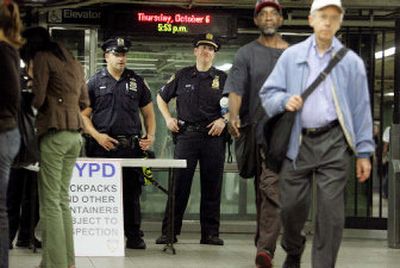 
New York City police officers keep watch inside the Union Square subway station on Thursday as the city  mobilized in response to a 