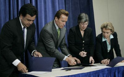 
 From left, New Mexico Gov. Bill Richardson, California Gov. Arnold Schwarzenegger, Arizona Gov. Janet Napolitano  and Washington Gov. Chris Gregoire  participate in a signing ceremony for the Western Regional Climate Action Initiative  on Monday. 
 (Associated Press / The Spokesman-Review)