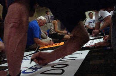 
Supporters of George W. Bush and George Nethercutt gathered in the basement of the America West Building to make signs welcoming President Bush. 
 (Jed Conklin / The Spokesman-Review)