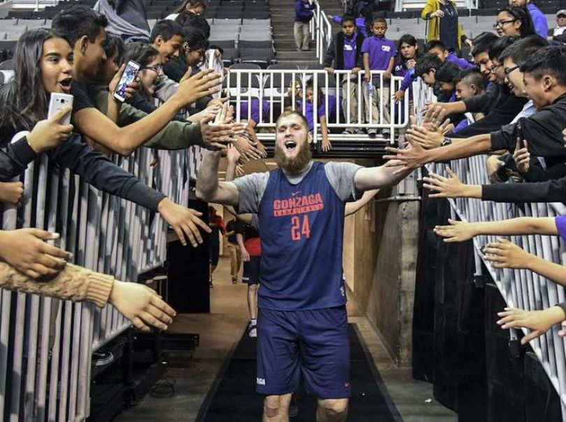 Gonzaga center Przemek Karnowski is greeted by school children as he enters the court at the SAP Center during open practice Wednesday, March 22, 2017, in San Jose. (Dan Pelle / The Spokesman-Review)