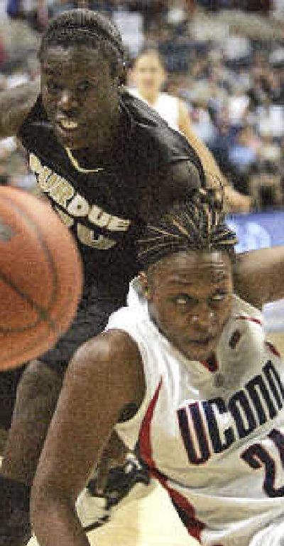 
Purdue's Fahkara Malone and UConn's Charde Houston vie for a loose ball. UConn won 66-55.
 (Associated Press / The Spokesman-Review)