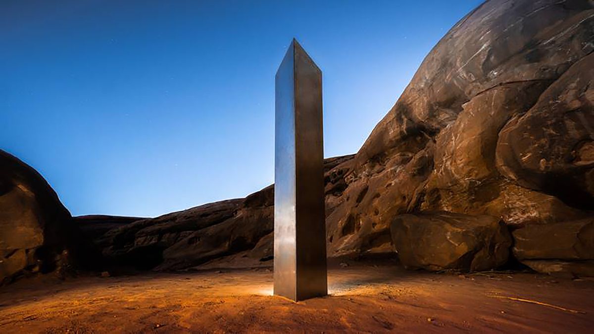FILE - In this Nov. 27, 2020, file photo, provided by Terrance Siemon, is a monolith that was placed in a red-rock desert in an undisclosed location in San Juan County southeastern Utah. Days after the arrival and swift disappearance of two shining metal monoliths spotted half a world away from each other, another towering structure has popped up, this time at the pinnacle of a trail in Southern California. Its straight sides and height appear similar to one discovered in the Utah desert and another that was found in Romania.  (Terrance Siemon)