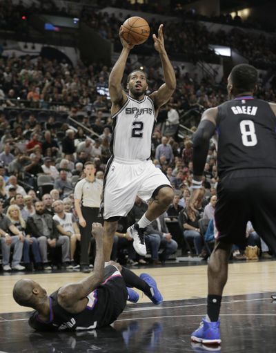 San Antonio’s Kawhi Leonard scores 2 of his team-high 20 points. (Associated Press)