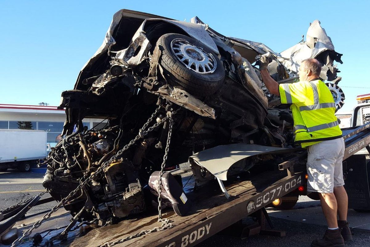 Police say this car sped away after officers tried pulling it over Wednesday, then crashed on East Sprague Avenue near Sherman Street. (Chad Sokol / The Spokesman-Review)