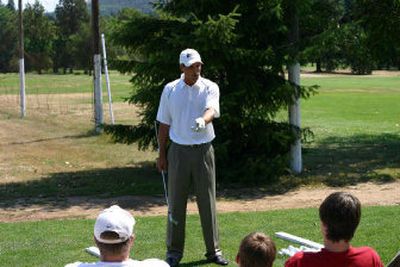 
Travis Fulton works with a group of Kellogg High School golfers recently.
 (Photo courtesy of Simon Miller / The Spokesman-Review)
