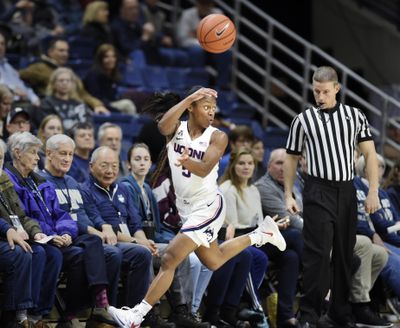 Connecticut’s Crystal Dangerfield (5) looks for an outlet after stealing the ball during the first half of the team’s NCAA college basketball game against Cincinnati on Wednesday, Jan. 9, 2019, in Storrs, Conn. (Stephen Dunn / Associated Press)