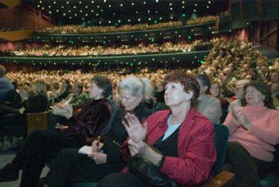
Starbucks Coffee shareholders Linda Stein, left, Jeana McKee, center, and Delores Amber appauld during the annual meeting of shareholders on Wednesday in Seattle. 
 (Associated Press photos / The Spokesman-Review)