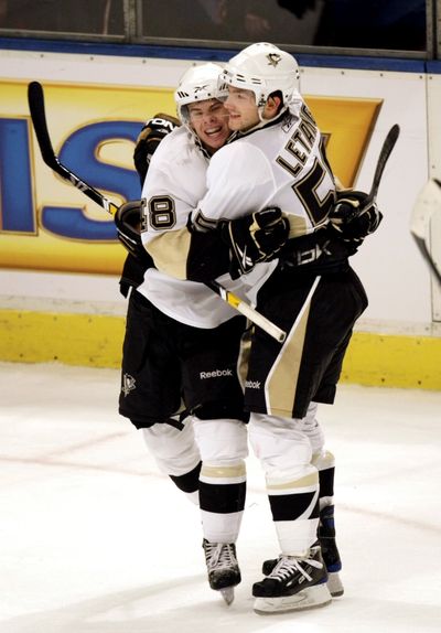 Pittsburgh’s Kris Letang, right, greets Tyler Kennedy after his winning goal in overtime.  (Associated Press / The Spokesman-Review)
