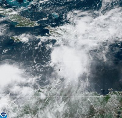 In this satellite image provided by the National Oceanic and Atmospheric Administration, Tropical Storm Franklin approaches Hispaniola on Tuesday. Authorities in the Dominican Republic prepared to shut down much of the country Tuesday as the storm took aim at the island it shares with Haiti.    (NOAA/TNS)