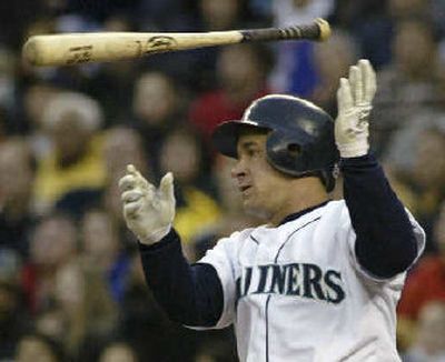 
Bret Boone flinging his bat after a base hit, which was a familiar sight, though not as often this year.
 (Associated Press / The Spokesman-Review)