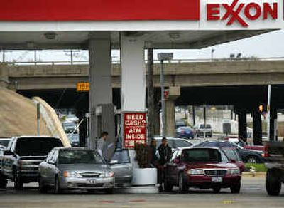 
An Exxon station is shown in Dallas last month. On Friday, Exxon Mobil Corp. became the largest U.S. corporation by stock market value, passing longtime leader General Electric.
 (Associated Press / The Spokesman-Review)