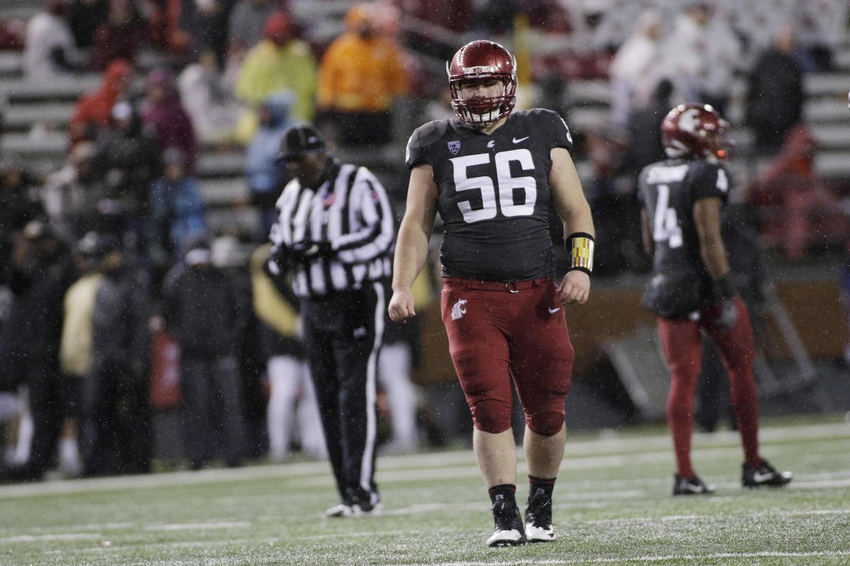 Washington State defensive lineman Taylor Comfort  walks on the field during the second half against Colorado in Pullman on Oct. 21, 2017. (Young Kwak / AP)