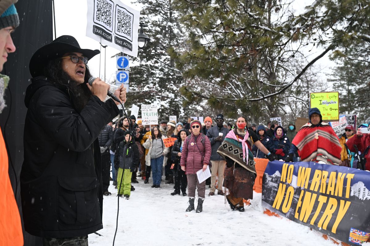 Justice Forral, left, of Spokane Community Against Racism, speaks to the crowd of protesters gathered in February in Riverfront Park. They were protesting several issues including immigration enforcement under President Donald Trump. A rule proposed by Spokane City Councilwoman Lili Navarrete seeks to bar federal agents from entering parts of city parks where groups are holding ticketed community events unless they have a warrant. (Photos by Jesse Tinsley/The Spokesman-Review)