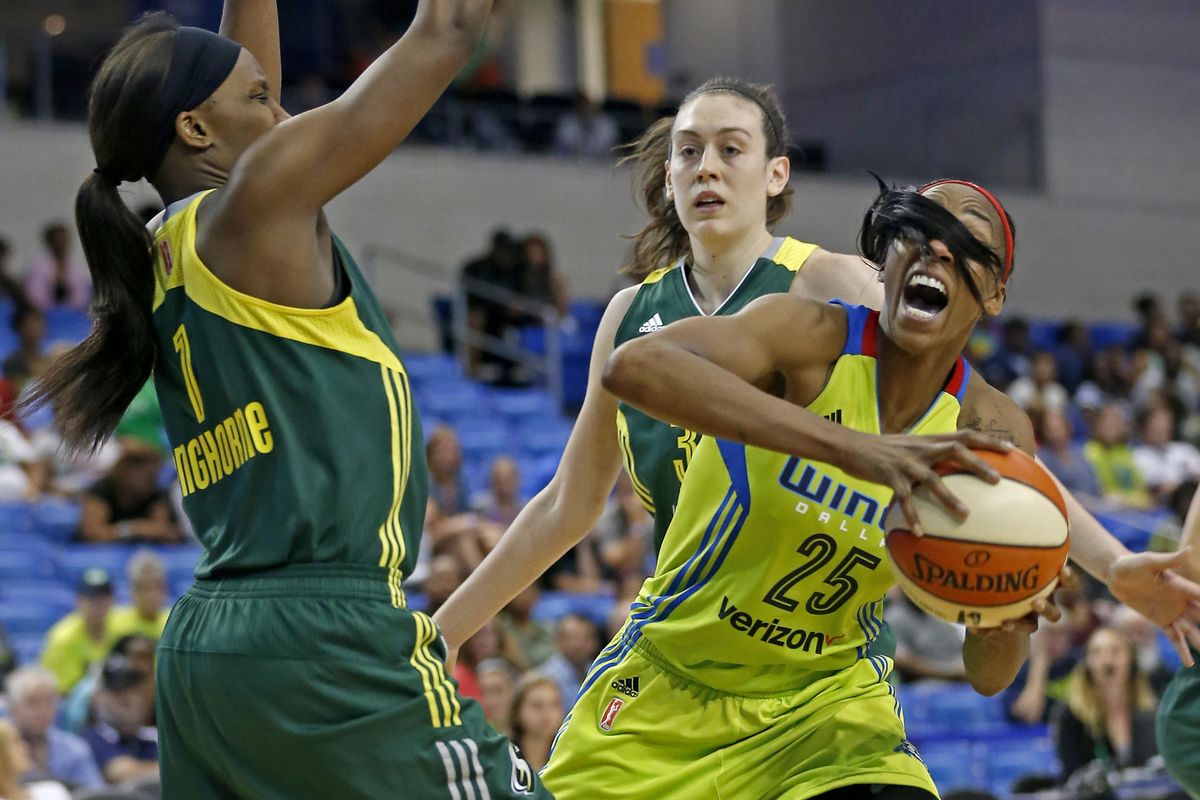 Dallas Wings forward Glory Johnson has her hair wrap around in front of her eyes as she is defended by Seattle Storm forward Crystal Langhorne (1) during the second half of a WNBA basketball game in Arlington, Texas, Saturday, July 1, 2017. (Jae S. Lee / Dallas Morning News via AP)