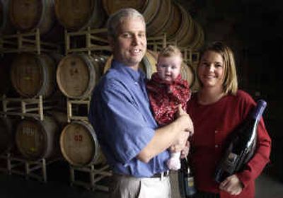 
Bob and Kimber Harris, with daughter Scarlet, are starting a family and running a winery, Coeur d'Alene Cellars,  in Coeur d'Alene. 
 (Jesse Tinsley / The Spokesman-Review)