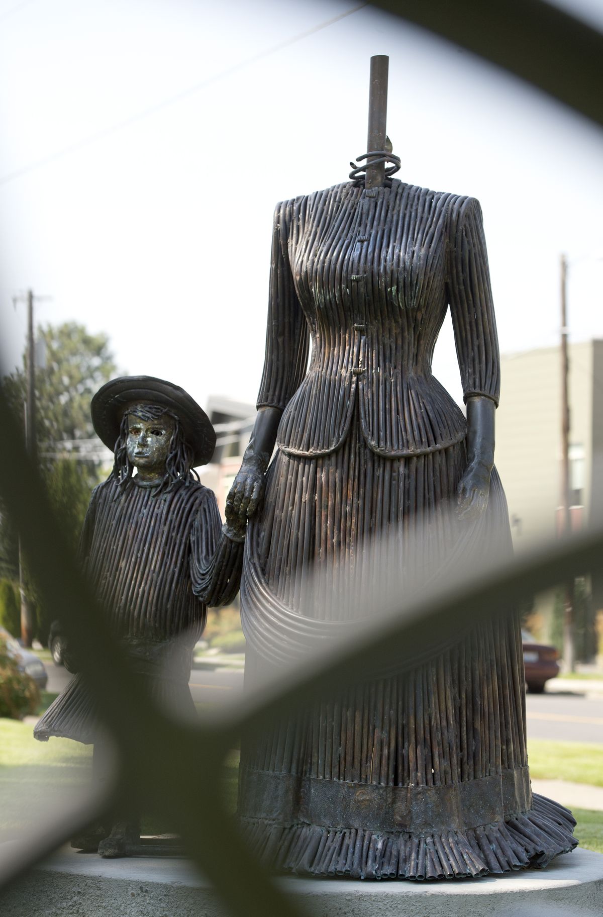 The headless statue stands at the entrance to Browne’s Addition on Wednesday. (Dan Pelle)