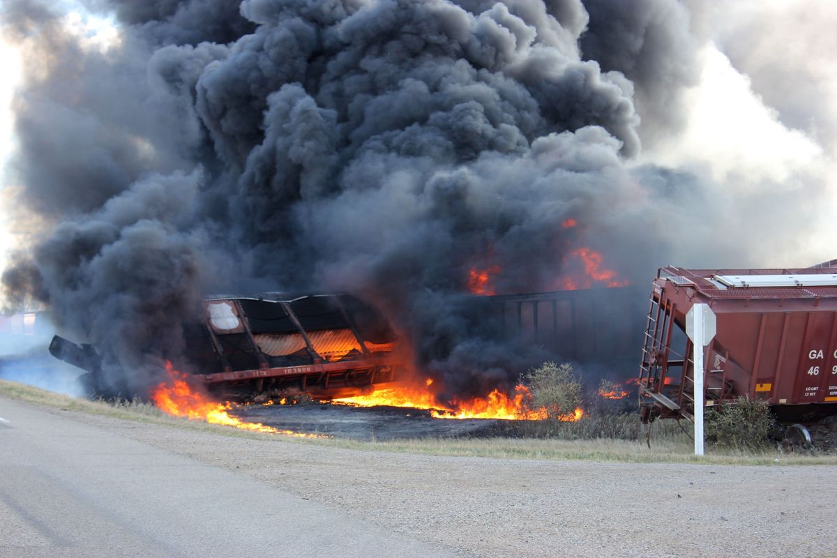 A Canadian National Railway Company freight train carrying dangerous goods is shown after it derailed in central Saskatchewan, near the towns of Wadena and Clair, on Tuesday, Oct. 7, 2014. (Alison Squires / The Canadian Press)