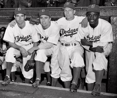 In this April 15, 1947, file photo, from left, Brooklyn Dodgers baseball players John Jorgensen, Pee Wee Reese, Ed Stanky and Jackie Robinson pose at Ebbets Field in New York. (Associated Press)