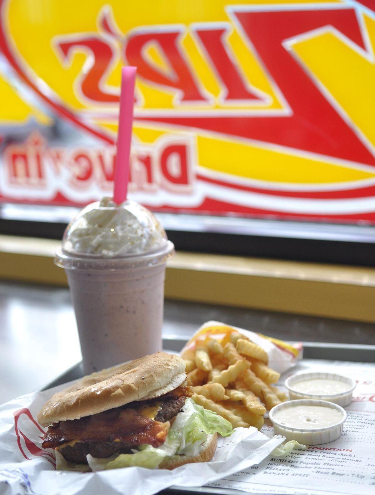 A huckleberry shake, a bacon burger and Zip’s signature crinkle-cut fries - it’s what Spokane likes to eat. (Adriana Janovich / The Spokesman-Review)