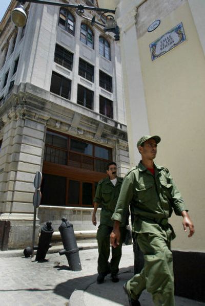 
Army reservists patrol the streets of Havana, Cuba, Saturday as part of a slight increase in security seen since President  Fidel Castro temporarily ceded power. 
 (Associated Press / The Spokesman-Review)