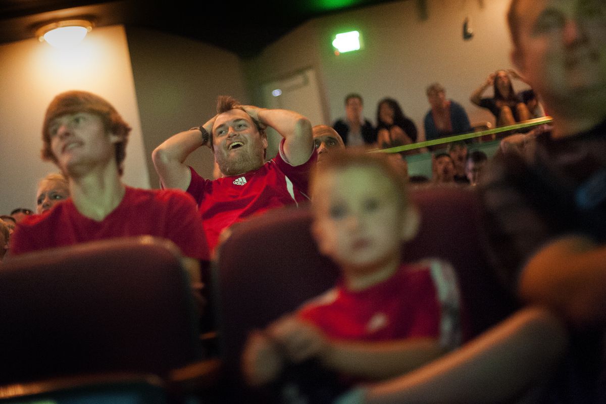 Andreas Andersson, center, reacts with fans as USA faces Portugal during a World Cup watch party at the Bing Crosby Theater on Sunday in Spokane. The Spokane Youth Sports Association sponsored the event. (Tyler Tjomsland)