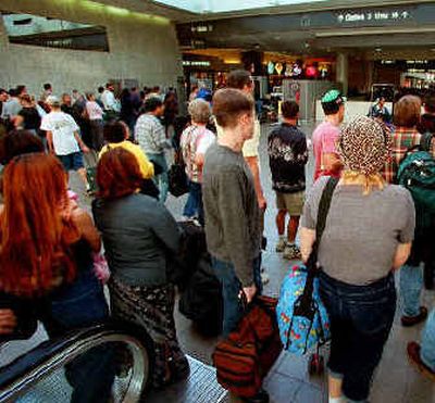 
Crowded airports may become even more commonplace in the next decade.
 (Associated Press / The Spokesman-Review)