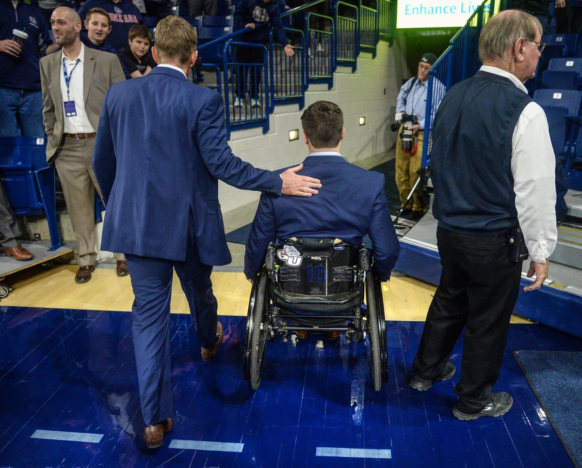 Mac Graff leaves the McCarthey Athletic Center court with Gonzaga coach Mark Few after a November win over Texas A&M. (Dan Pelle / The Spokesman-Review)