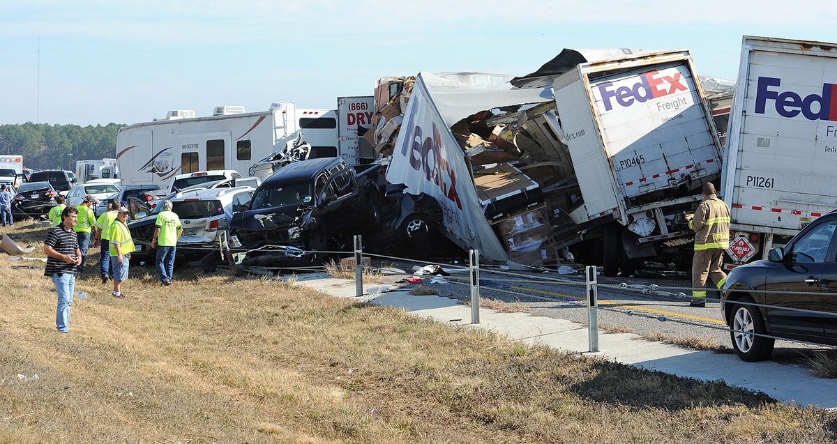 Cars and Trucks are piled on Interstate 10 in Southeast Texas Thursday Nov. 22, 2012.  The Texas Department of Public Safety says at least 35 people have been injured in a more than 50-vehicle pileup. (Guiseppe Barranco / The Beaumont Enterprise)