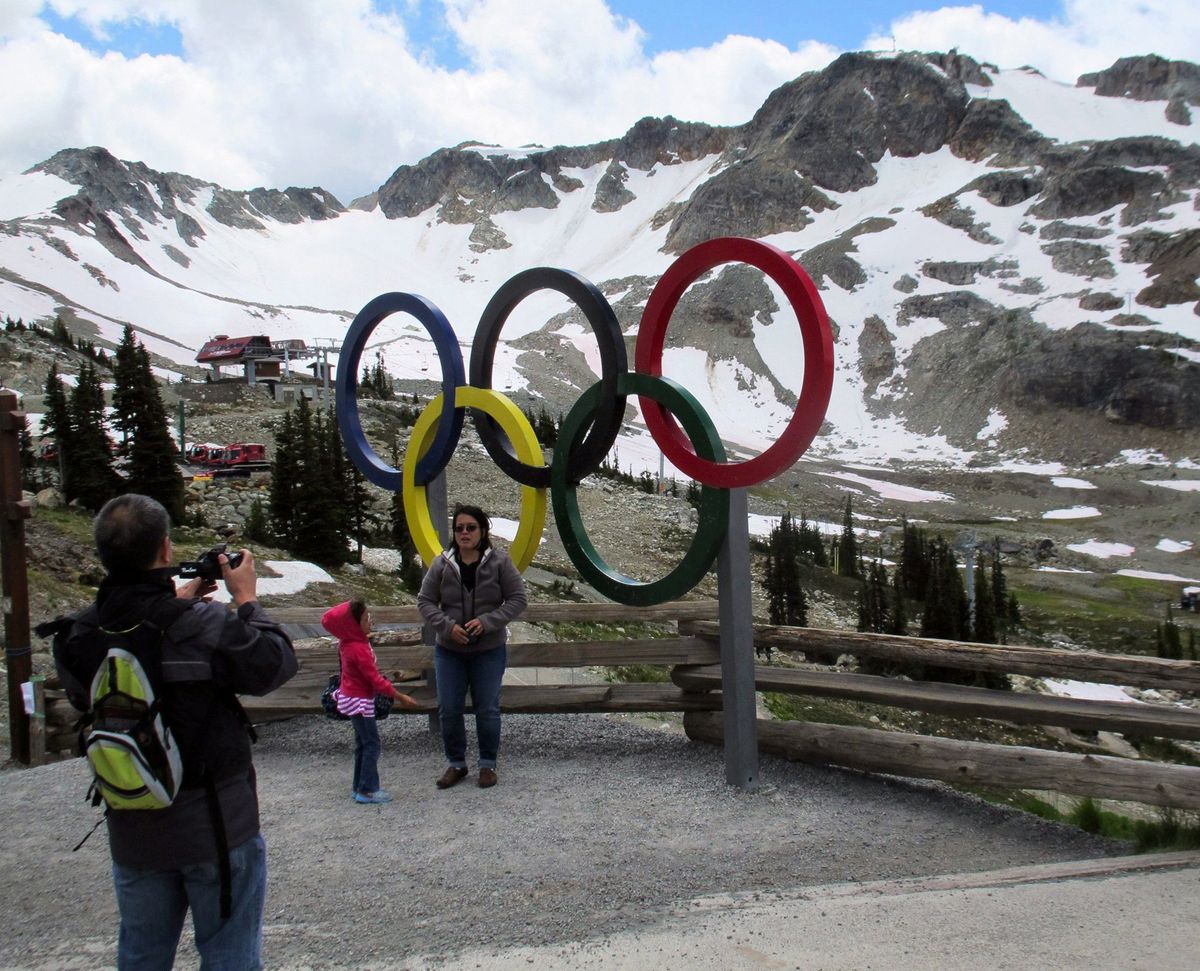 Visitors snap photos by the Olympic rings midway up Whistler Mountain outside Vancouver, B.C., last month. The region played host to the 2010 Winter Olympics.