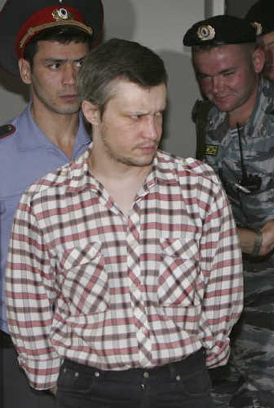 
Alexander Pichushkin is taken to a Moscow courtroom Monday.Associated Press
 (Associated Press / The Spokesman-Review)