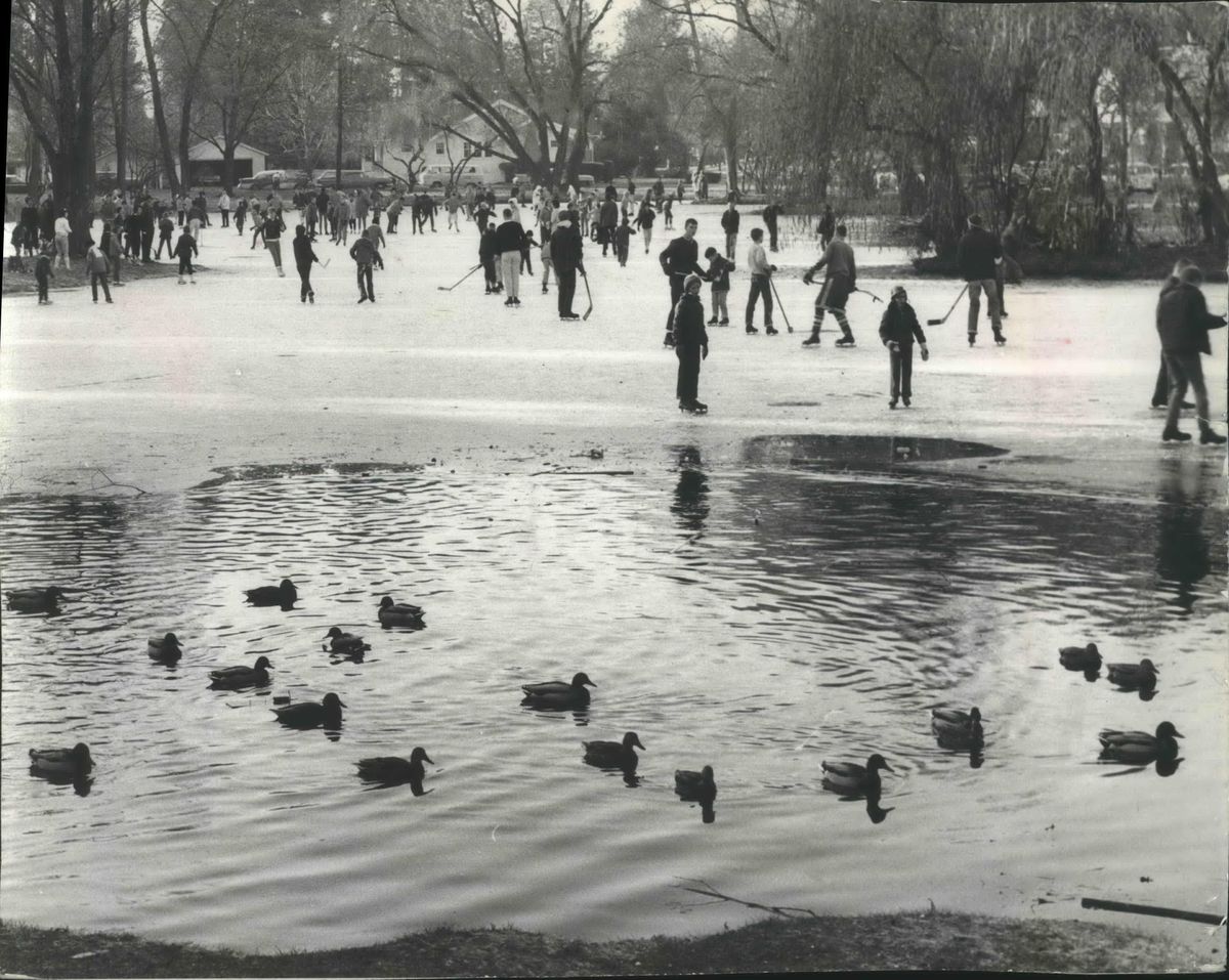 1963: Neighborhood hockey players and others crowd the ice on the Manito Park duck pond in December 1963. A picnic spot in the summer and a skating spot in winter, the natural lake was a popular site for recreation since before the park land was donated to the city by developer Jay P. Graves in 1903. (Spokesman-Review Photo Archive / SR)