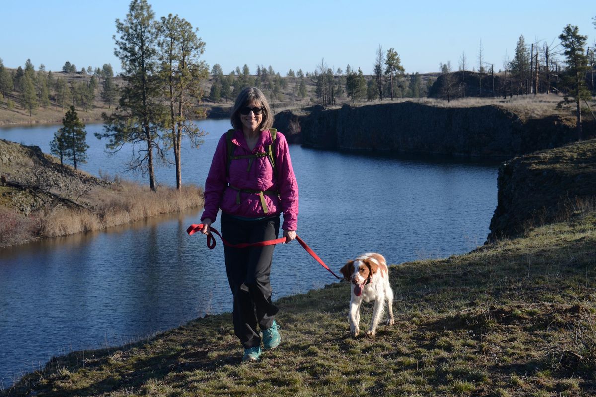 Meredith Heick finds plenty of elbow room for exercising with her dog, Ranger, at Fishtrap Lake Recreation area, one of several large blocks of public land close to Spokane.  Photo by Rich Landers (Rich Landers / The Spokesman-Review)