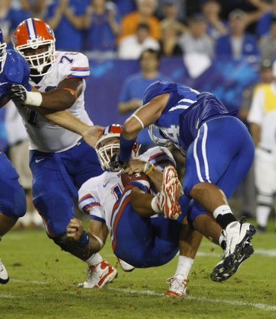Florida quarterback Tim Tebow is sacked by Kentucky defensive end Taylor Wyndham in Florida’s 41-7 victory over the Wildcats.  (Associated Press / The Spokesman-Review)