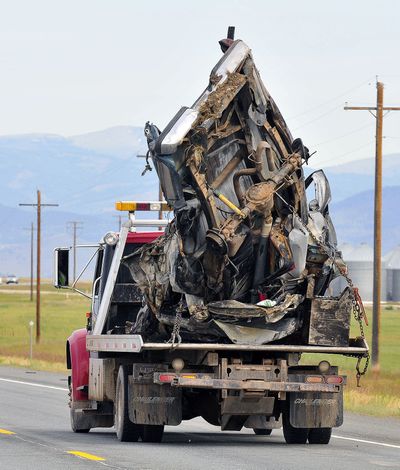 The wreckage of a pickup truck involved in a fatal accident is taken away from the scene Friday near Helena. (Associated Press)