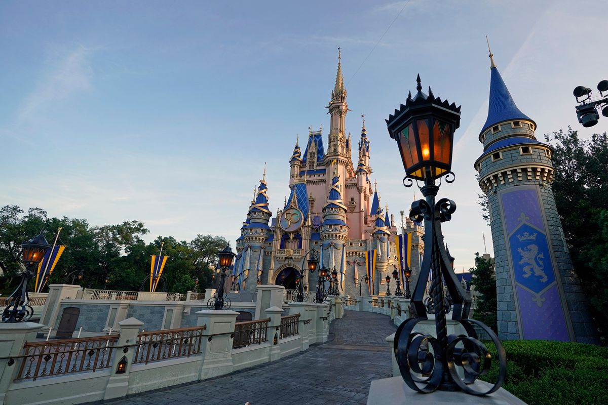 FILE - The newly painted Cinderella Castle at the Magic Kingdom at Walt Disney World is seen with the the crest to celebrate the 50th anniversary of the theme park Monday, Aug. 30, 2021, in Lake Buena Vista, Fla. The idea was presented to Florida lawmakers 55 years ago: Let Disney form its own government and in exchange it would create a futuristic city of tomorrow. That city never materialized, but Walt Disney World became an economic juggernaut, and its government retained unprecedented powers. Five decades later, Gov. Ron DeSantis is asking lawmakers to end Disney’s government in a move that throws a wrench into decades of symbiotic relations between the company and state government. (Associated Press)