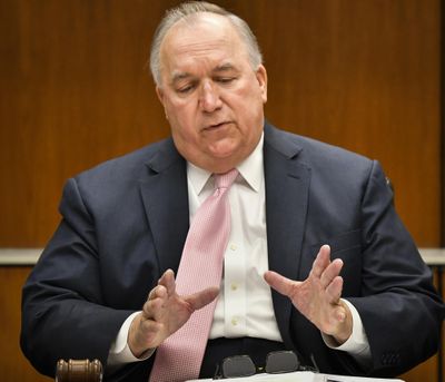 Michigan State University interim President John Engler apologies to Larry Nassar's sexual assault victims Friday, June 22, 2018, before calling to order the first MSU Board of Trustees meeting in East Lansing, Mich. (Matthew Daie Smith / Lansing State Journal)