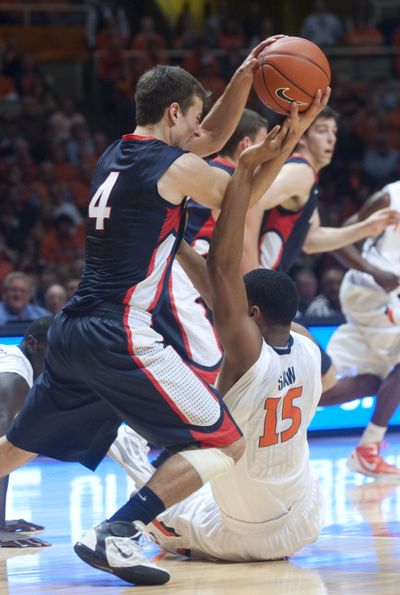 Gonzaga Kevin Pangos (4) grabs the ball from Illinois' Mike Shaw (15) during the first half of an NCAA college basketball game in Champaign, IL.  Saturday, Dec. 3, 2011. (Robert O'daniell / Fr57918 Ap)