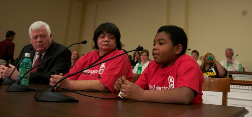 Eleven-year-old Marcelas Owens, seen here with his grandmother Gina Owens  and Rep. Jim McDermott, D-Wash.,  testifying on Capitol Hill in Washington, D.C., on March 10, has come under fire from conservative talk show hosts and columnists who say he’s being exploited. McClatchy Tribune (McClatchy Tribune)