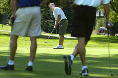 
Ex-GU assistant basketball coach Bill Grier, now head coach at San Diego, practices Friday at Spokane Country Club.
 (Christopher Anderson / The Spokesman-Review)