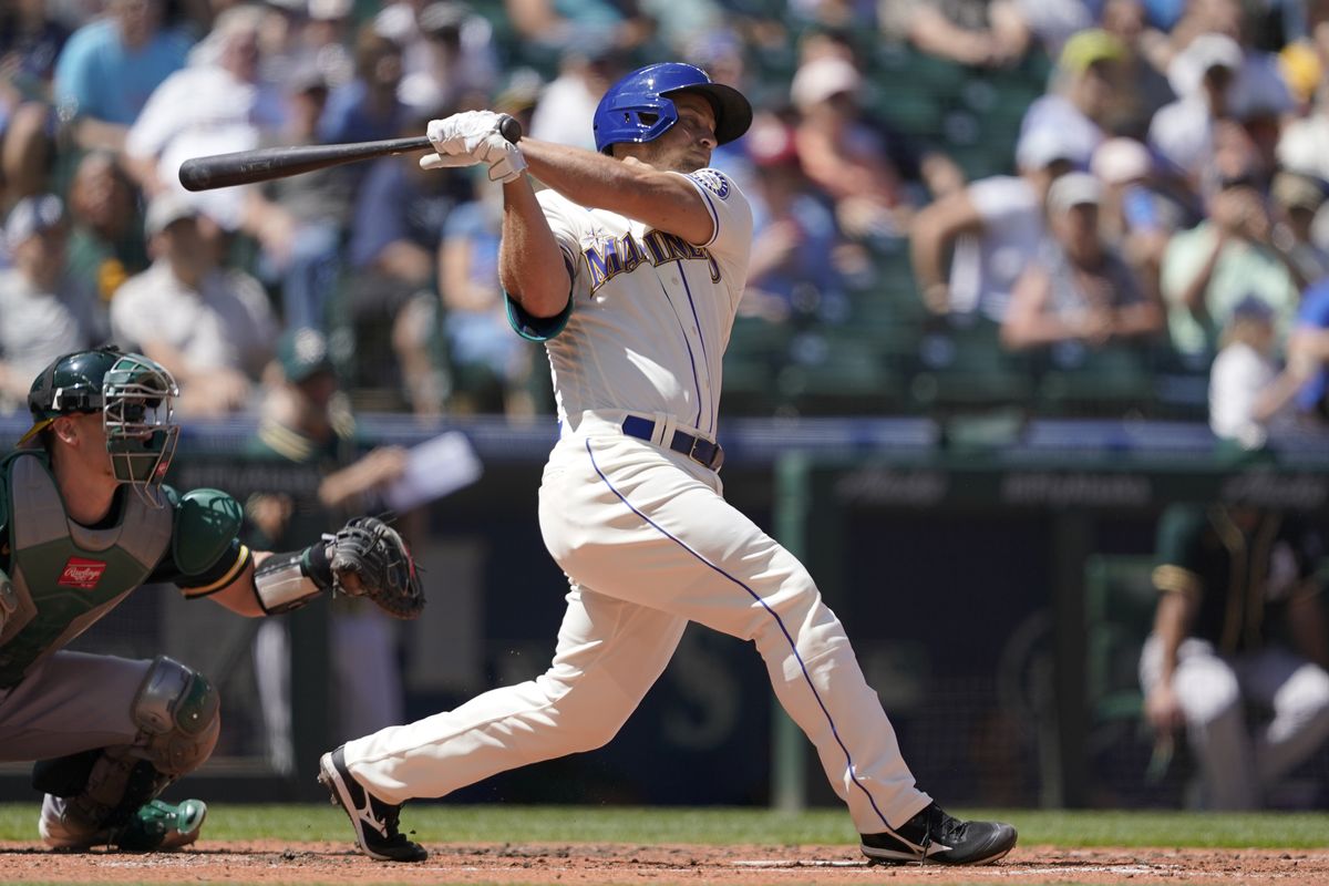 Seattle Mariners’ Kyle Seager hits a two-run single against the Oakland Athletics during the third inning Sunday in Seattle.  (Ted S. Warren)