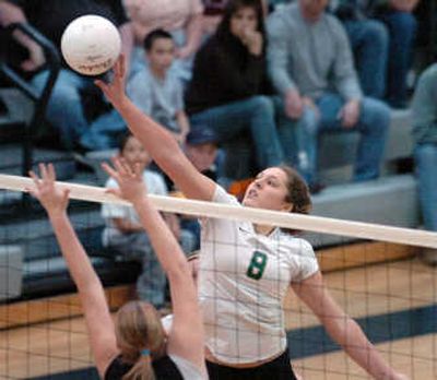 St. Maries' Shawna Heath tips the ball over the net during the district championship game Saturday in which the Lumberjacks defeated Priest River. Heath and a teammate had to sit out last year's state tournament.
(Jesse Tinsley / The Spokesman-Review)