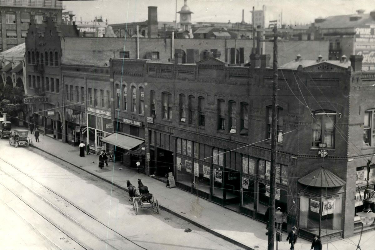 Facing Sprague Avenue before the construction of the Davenport Hotel on the block, there were, right to left, the Allen Building, two small buildings with a grocery and a bakery and the Pfister bar, which stretched from Sprague to First Avenue. At far left is Louis Davenport’s two-story restaurant, which was incorporated into the hotel. (SPOKESMAN-REVIEW PHOTO ARCHIVE / SR)