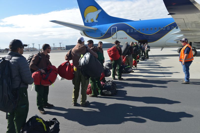 Wildland firefighters board a Canadian plane at the National Interagency Fire Center in Boise on Wednesday morning, bound for the Fort McMurray wildfire in Canada (NIFC)