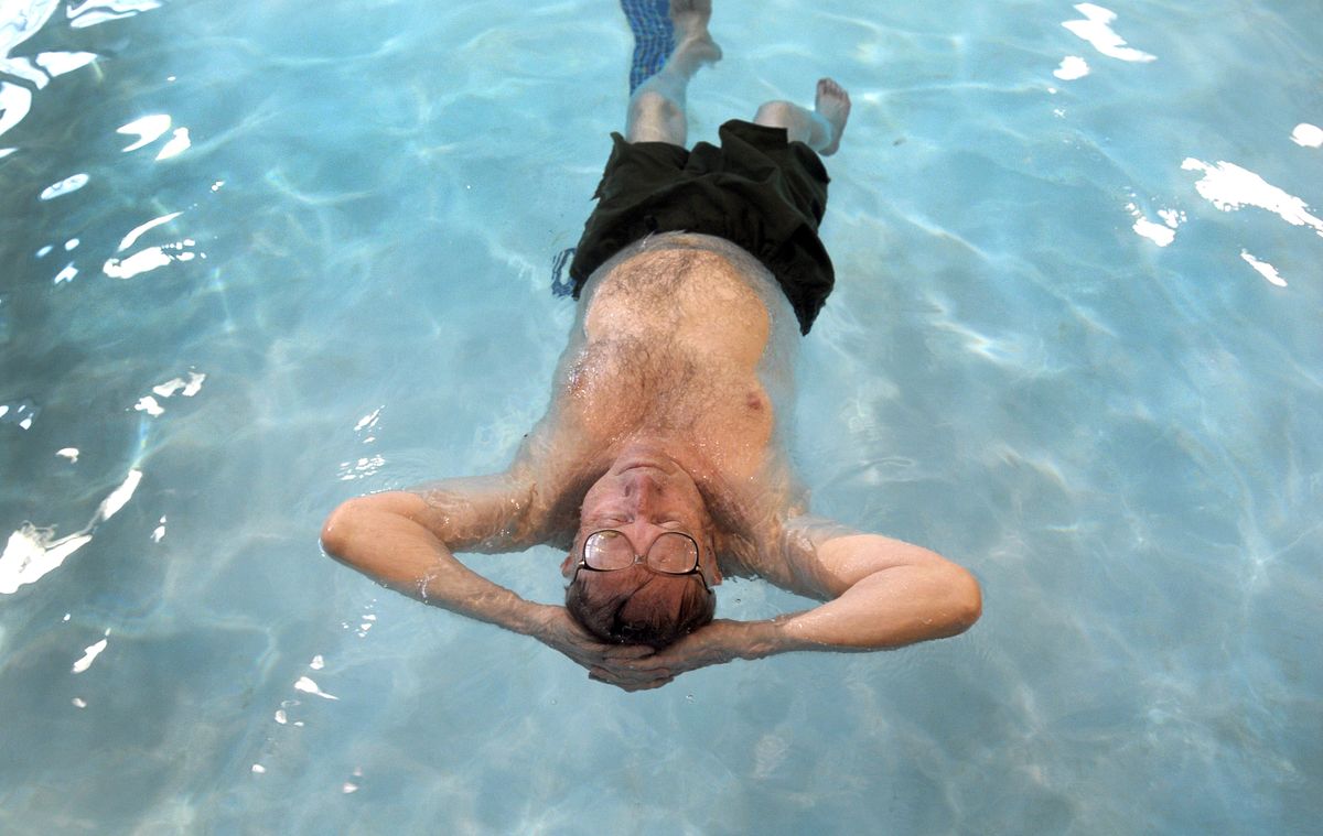 Eugene Keefer floats in the Salvation Army pool  April 14 in Spokane. (Christopher Anderson / The Spokesman-Review)